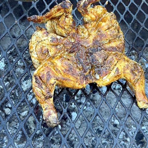 Flame-grilled chicken on the fire
