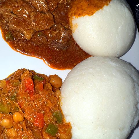 Close-up of beef stew, pap and chakalaka